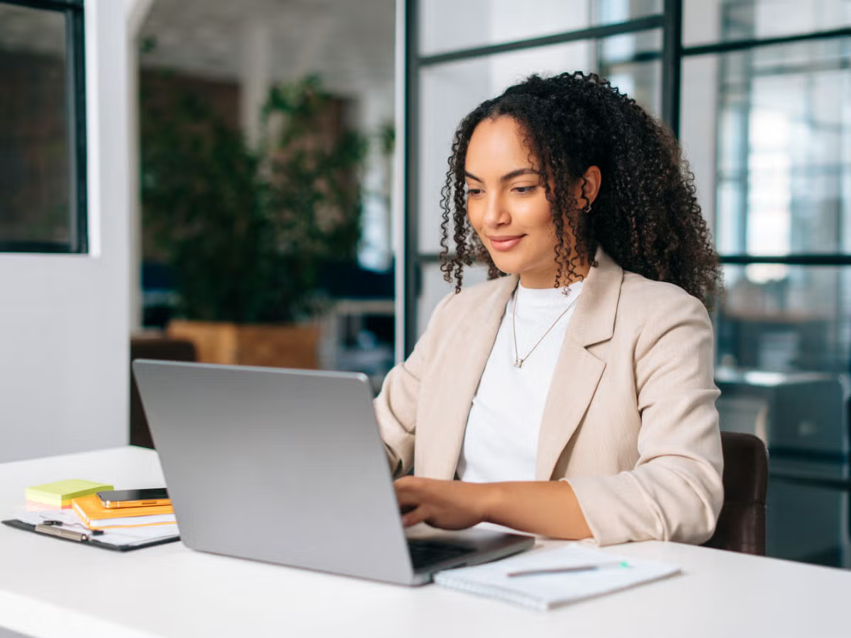 a women facing laptop
