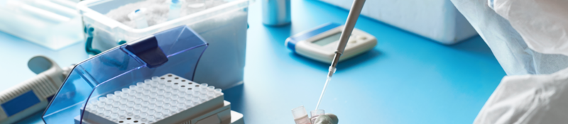 scientist adding fluid test tube