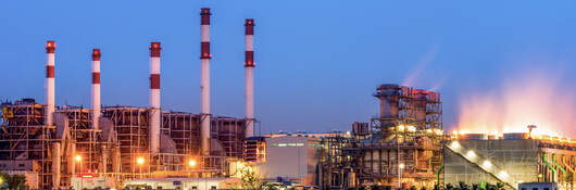 An oil refinery lit up at night. 